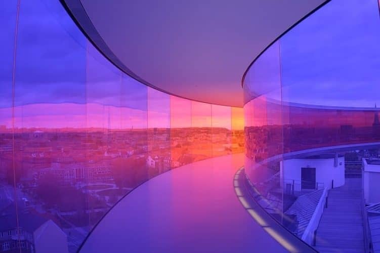 Curved glass walkway purple light